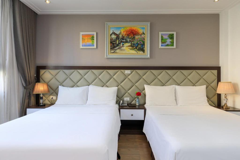 Postel nebo postele na pokoji v ubytování Yolo Wa Hotel