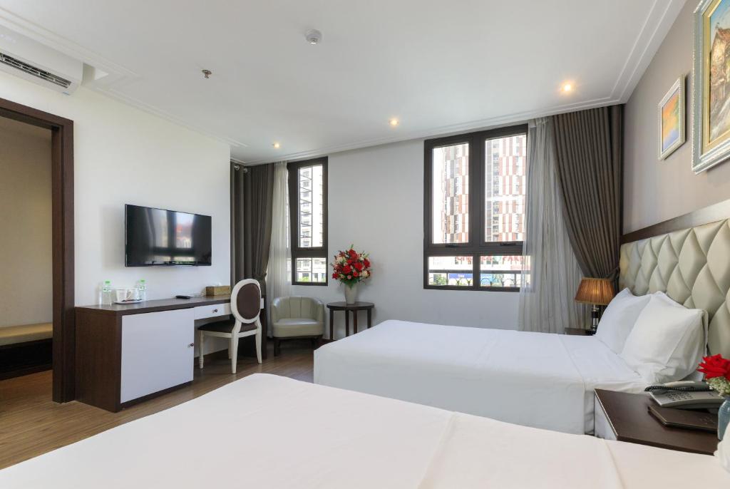 Postel nebo postele na pokoji v ubytování Yolo Wa Hotel