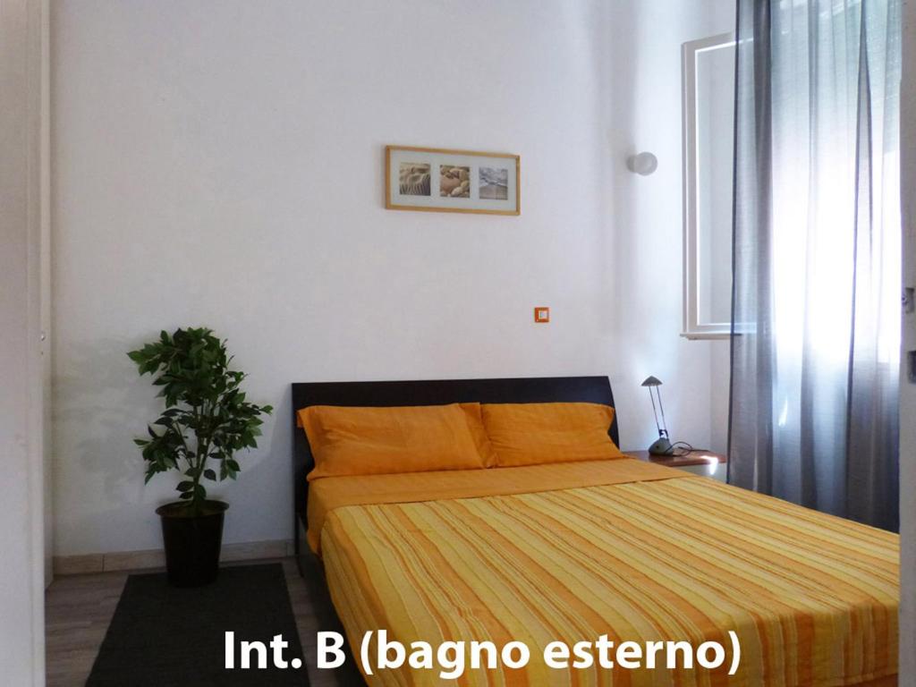 Postel nebo postele na pokoji v ubytování App Bilocale Gatteo Mare