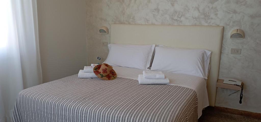Postel nebo postele na pokoji v ubytování Hotel Raul