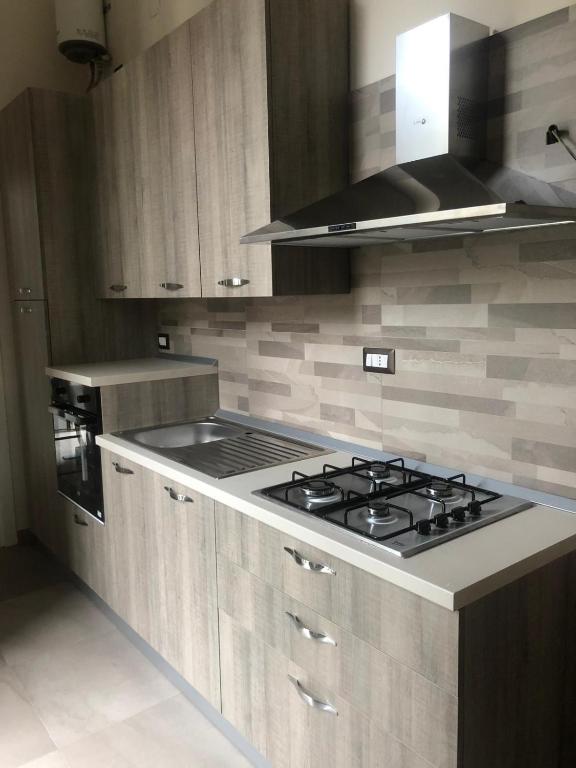 A kitchen or kitchenette at FORIA 58 APARTAMENTS