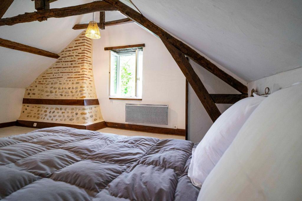 Posteľ alebo postele v izbe v ubytovaní Maison de charme à proximité de Pau - 3 chambres - 6 p - Jardin
