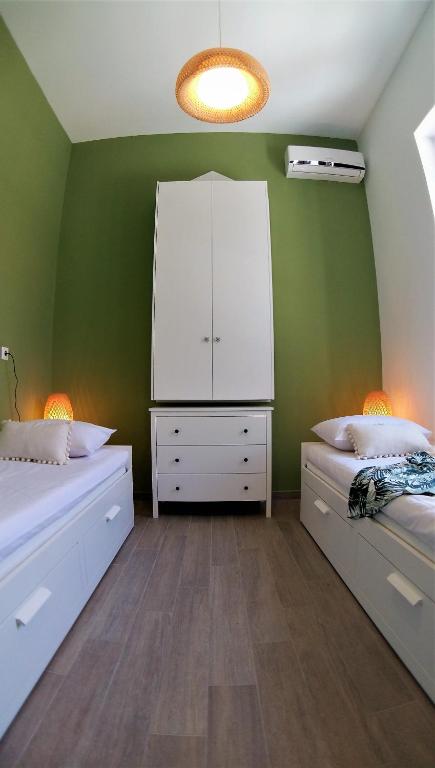 A bed or beds in a room at Villa Miranda