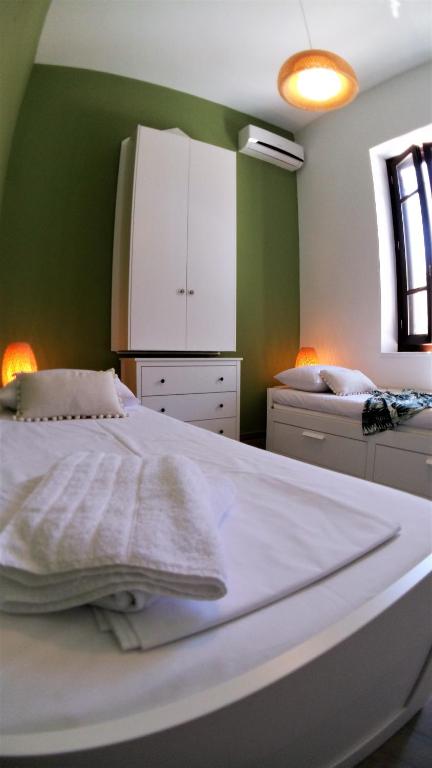 A bed or beds in a room at Villa Miranda