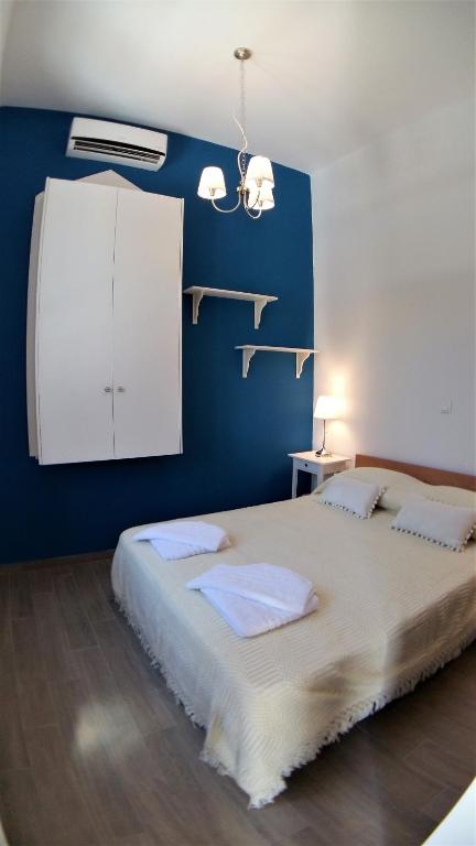 A bed or beds in a room at Villa Miranda