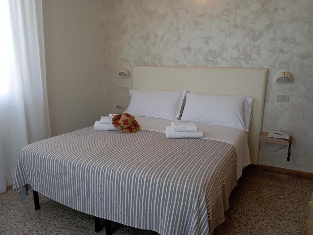 Postel nebo postele na pokoji v ubytování Hotel Raul