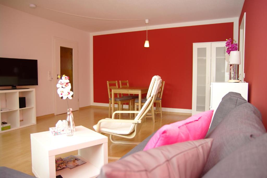 a living room with a couch and a table at Leipzig City Appartments in Leipzig