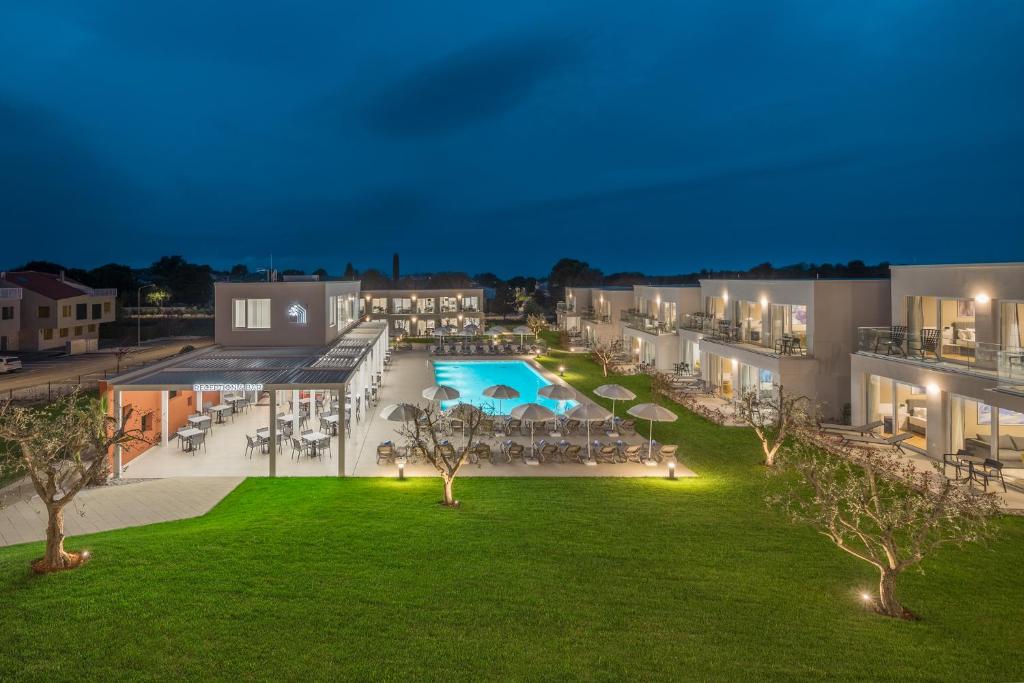 an aerial view of the courtyard of a resort at night at Maj Luxury Residence in Poreč