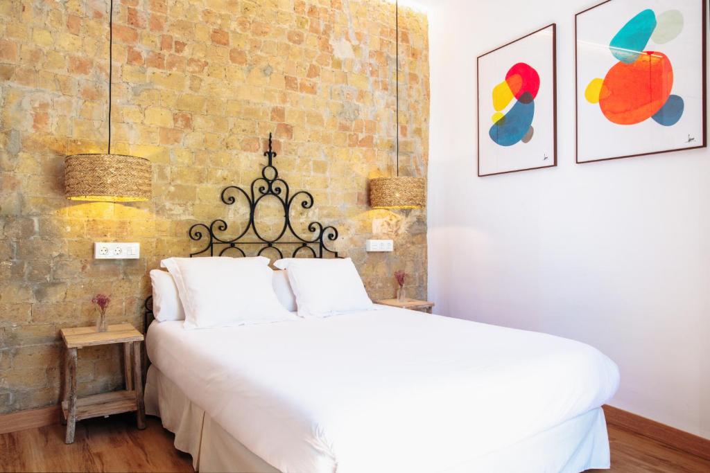 A bed or beds in a room at Casa de la Romanilla