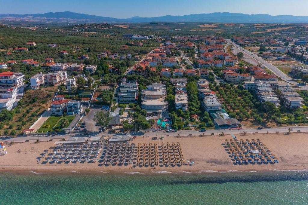 an aerial view of a beach with parked cars at Althea Suites by RentalsPro- Nea Moudania Halkidiki in Nea Moudania