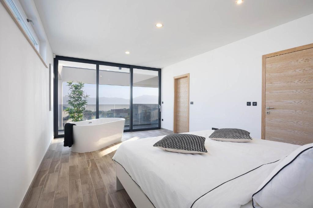 Ένα ή περισσότερα κρεβάτια σε δωμάτιο στο FIRST RESIDENCE Villa Middlearth