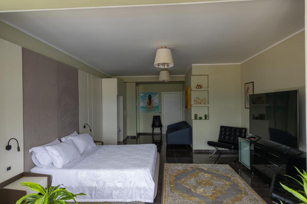 Postel nebo postele na pokoji v ubytování Hotel Pirro