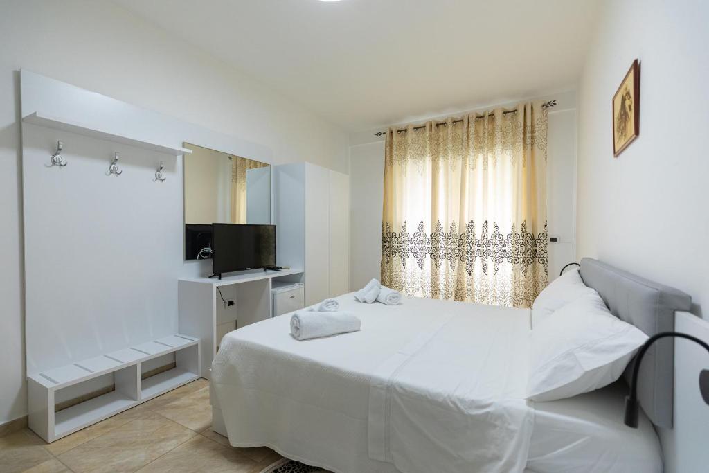 Postel nebo postele na pokoji v ubytování Hotel Pirro