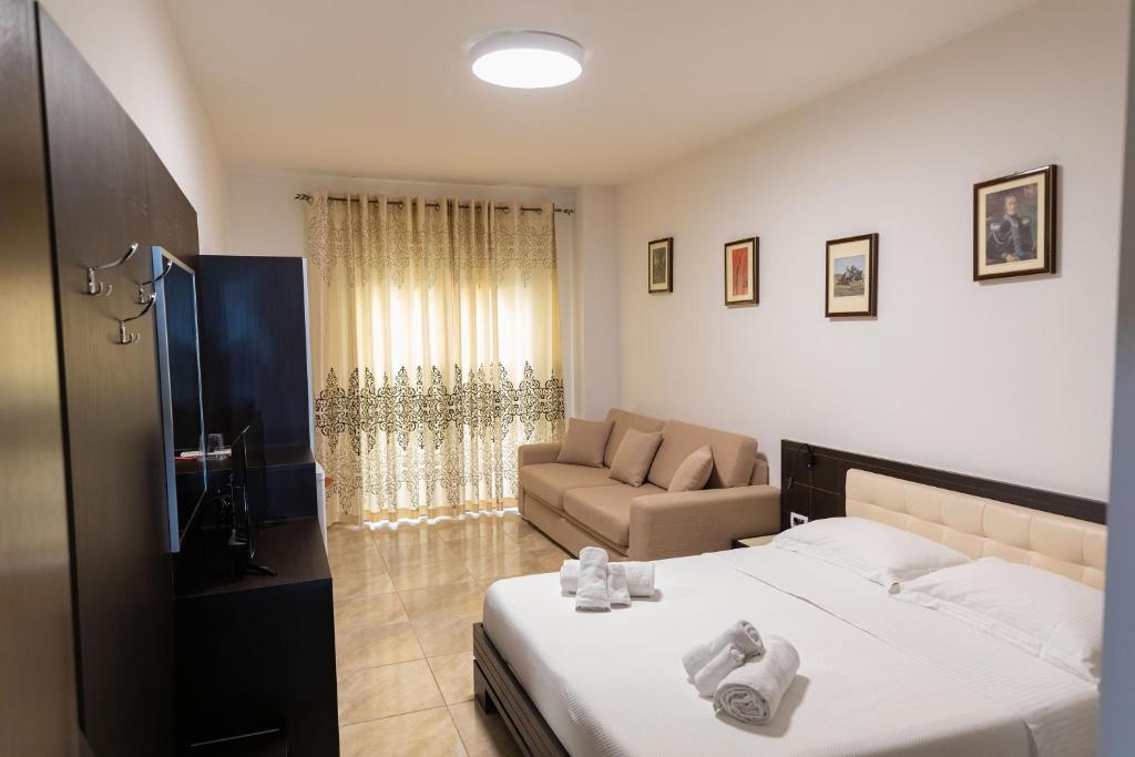 Postel nebo postele na pokoji v ubytování Hotel Pirro