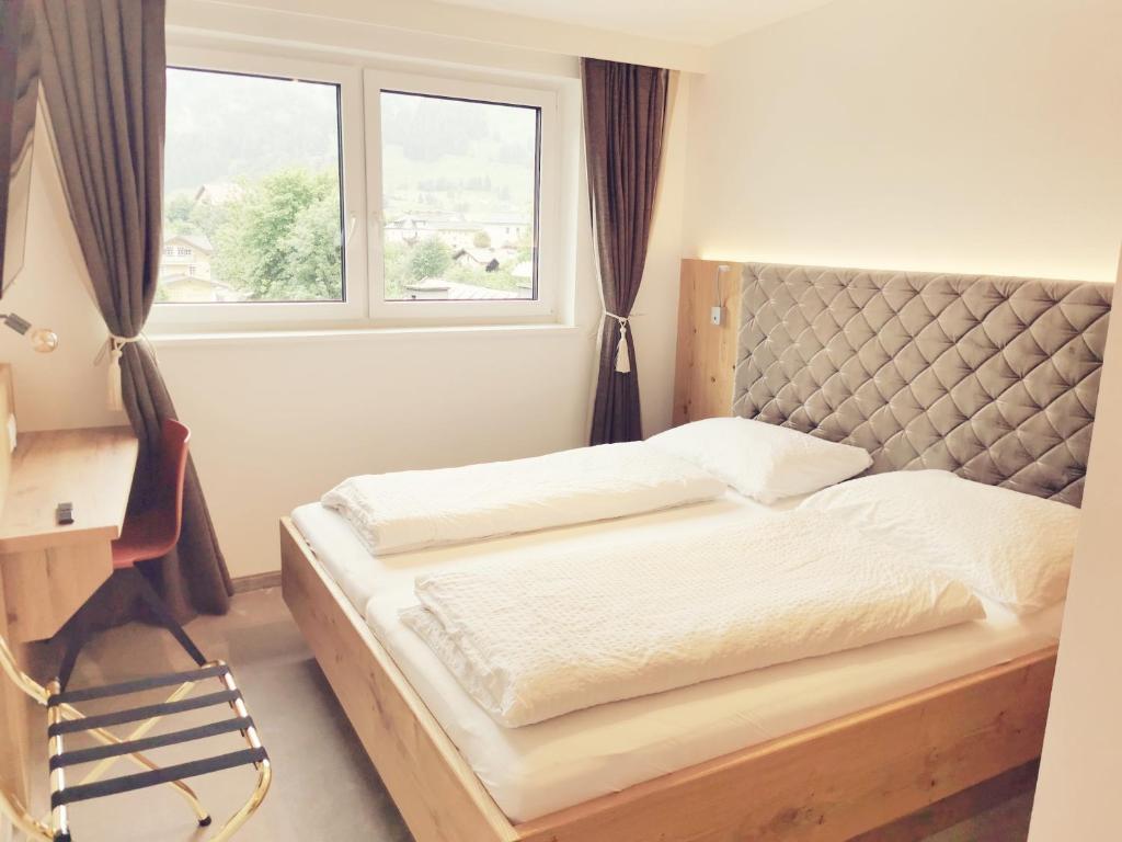Postel nebo postele na pokoji v ubytování Thurners Boutique Hotel