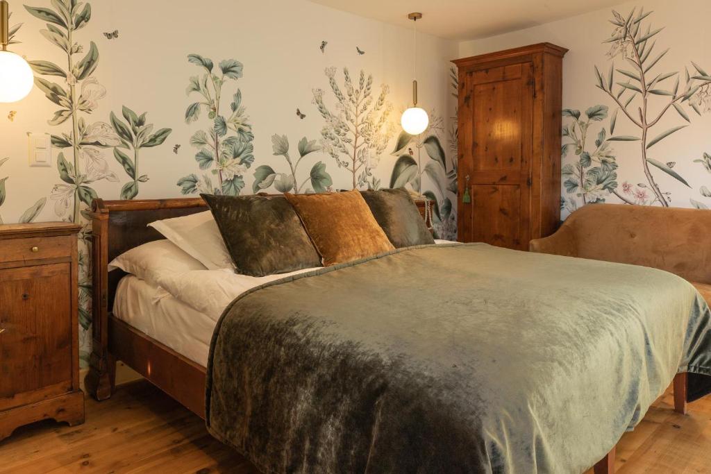 Postel nebo postele na pokoji v ubytování Hôtel Bella Tola & SPA