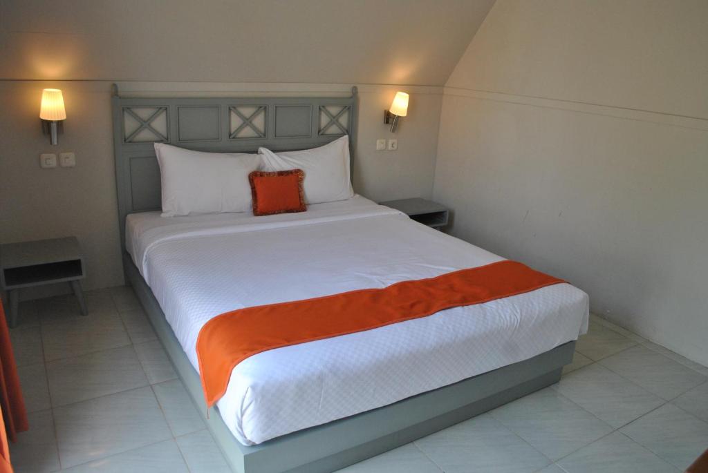 Postel nebo postele na pokoji v ubytování Seaside Villa & Muse Beach Resto