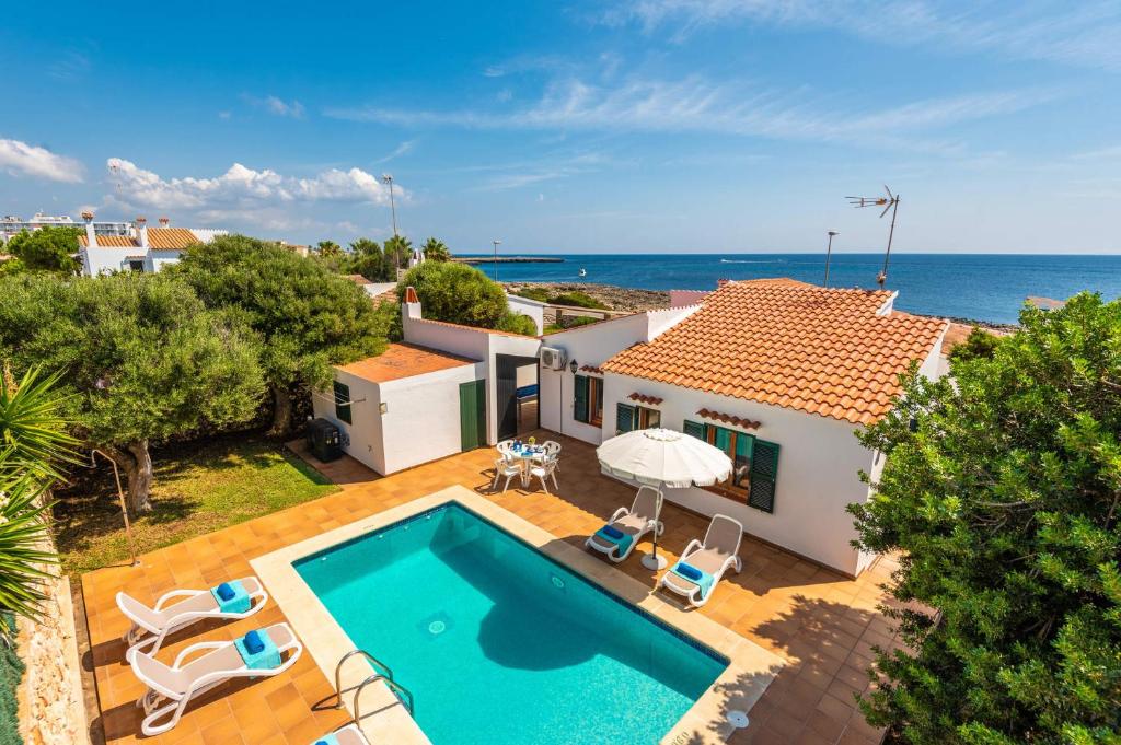 an aerial view of a villa with a swimming pool at Villa Petunia by Villa Plus in Cala'n Bosch