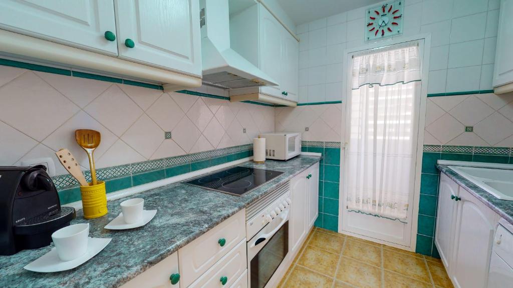 Kuchyň nebo kuchyňský kout v ubytování Apartamento Luz de Luna by Family Homes