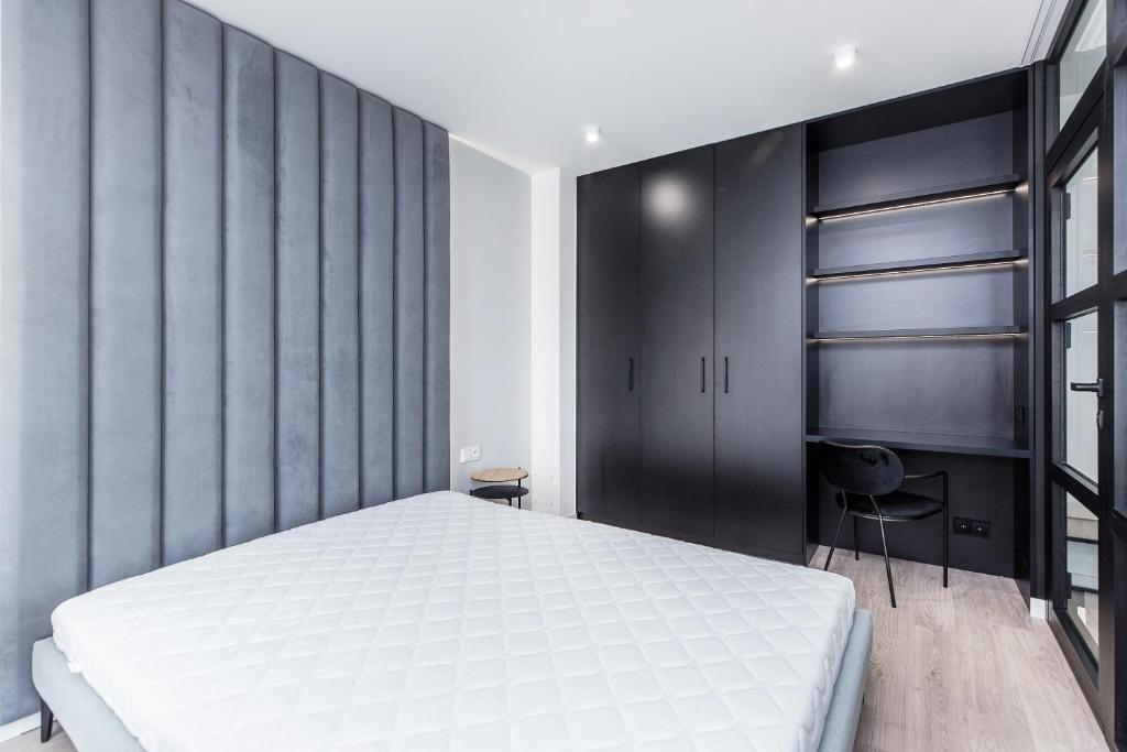 Posteľ alebo postele v izbe v ubytovaní Apartments Browar Kleparz by Noclegi Renters