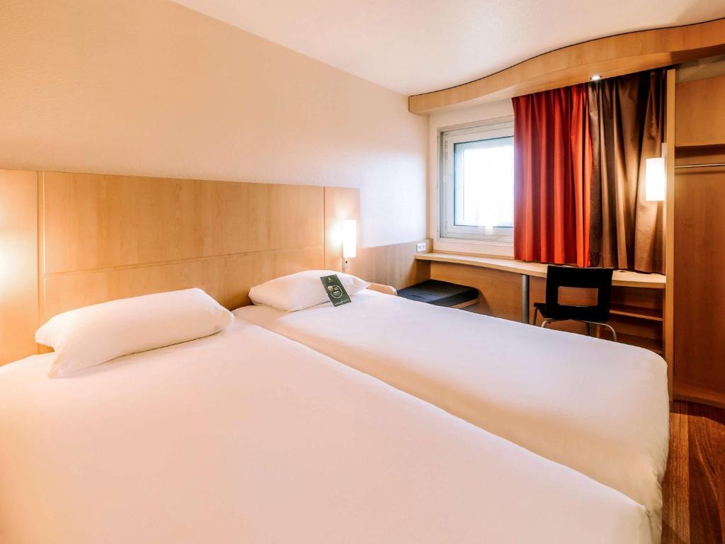 Postel nebo postele na pokoji v ubytování ibis Avignon Centre Gare