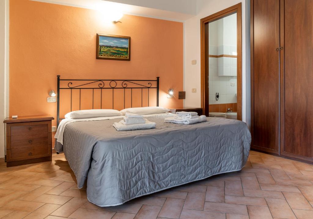 A bed or beds in a room at Agriturismo Al Girasole