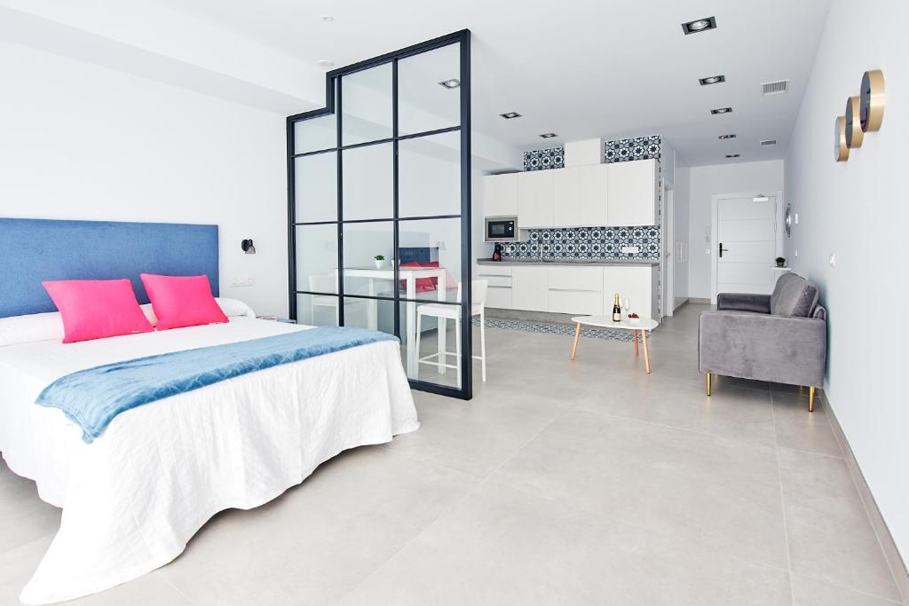 Posteľ alebo postele v izbe v ubytovaní 9 NIDOS Céntrica Suites - Nuevo