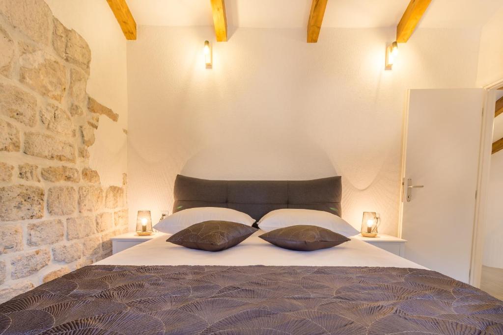 Postel nebo postele na pokoji v ubytování Olive Garden Apartment