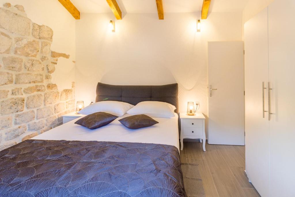 Postel nebo postele na pokoji v ubytování Olive Garden Apartment
