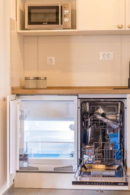 Kuchyň nebo kuchyňský kout v ubytování Olive Garden Apartment
