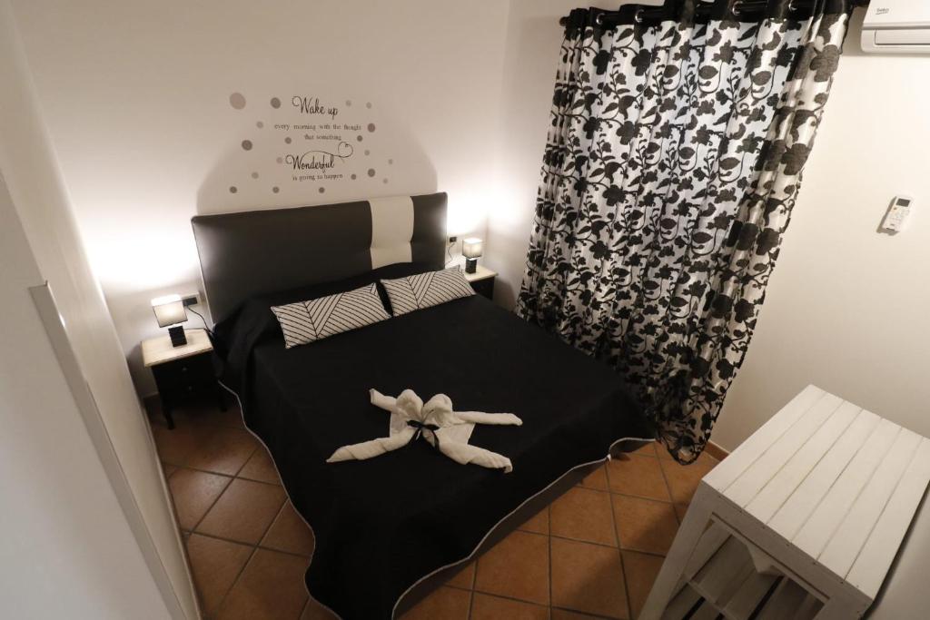 Posteľ alebo postele v izbe v ubytovaní Casa Palazzo Reale