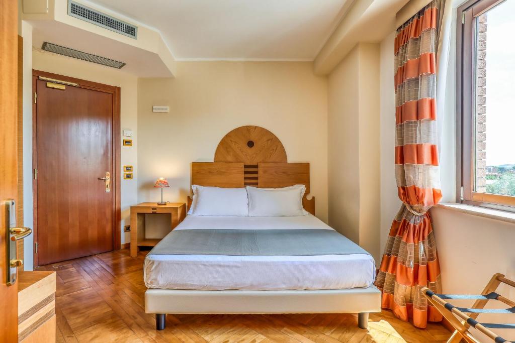 Postel nebo postele na pokoji v ubytování Hotel PentHouse