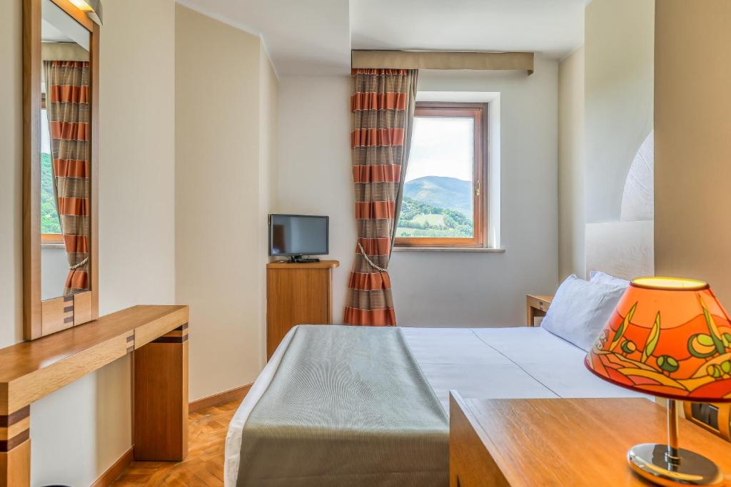 Postel nebo postele na pokoji v ubytování Hotel PentHouse