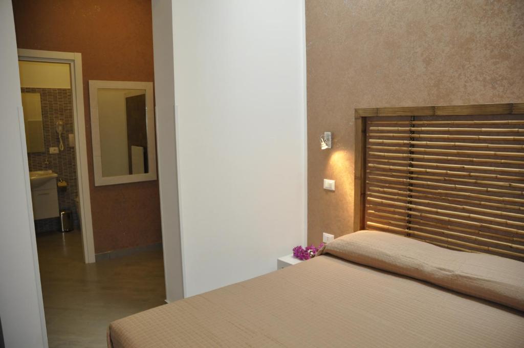 A bed or beds in a room at B&B Il Sole