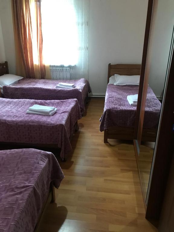 Postel nebo postele na pokoji v ubytování Guest House Gogia