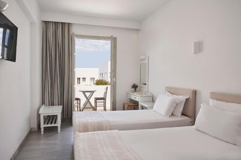 Postel nebo postele na pokoji v ubytování Polos Hotel Paros