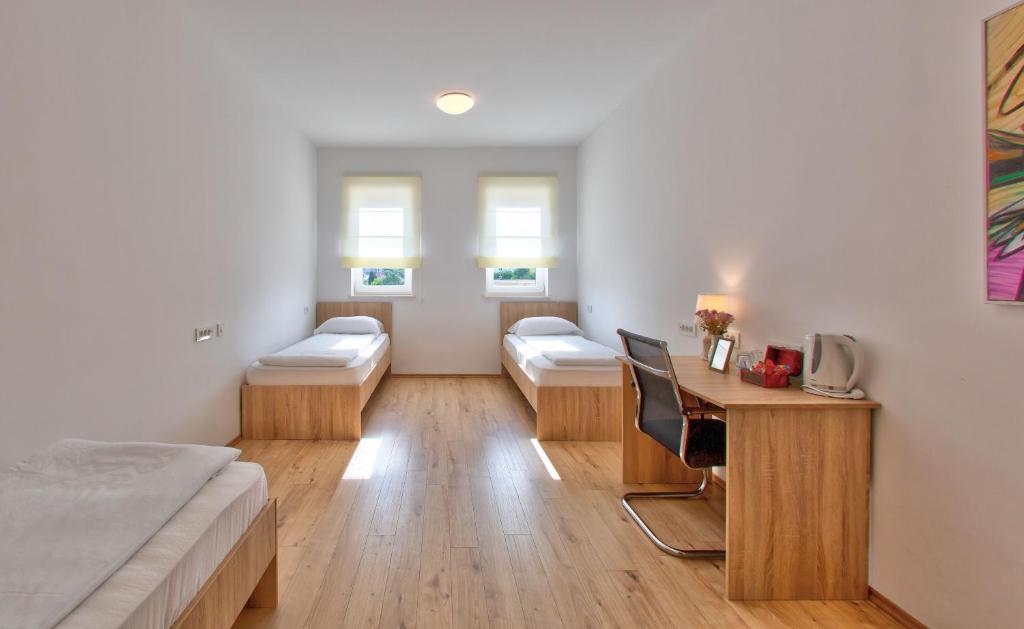 Postel nebo postele na pokoji v ubytování Hotel Dompes