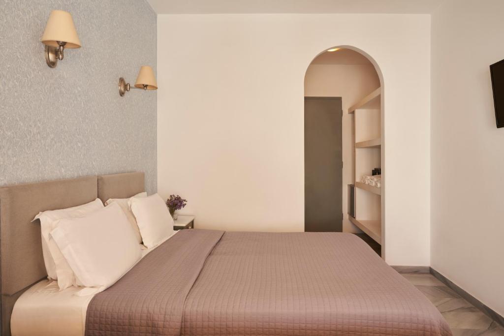 Postel nebo postele na pokoji v ubytování Polos Hotel Paros