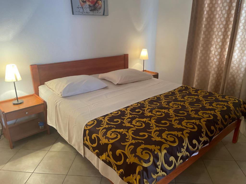 Postel nebo postele na pokoji v ubytování Apartments Iva