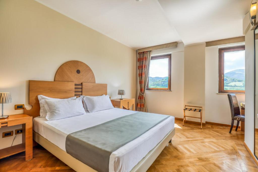 Postel nebo postele na pokoji v ubytování Hotel PentHouse