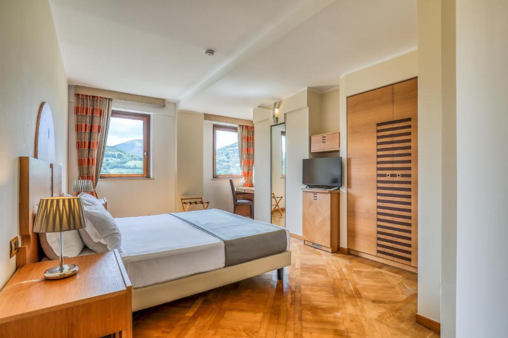 Postel nebo postele na pokoji v ubytování Hotel PentHouse