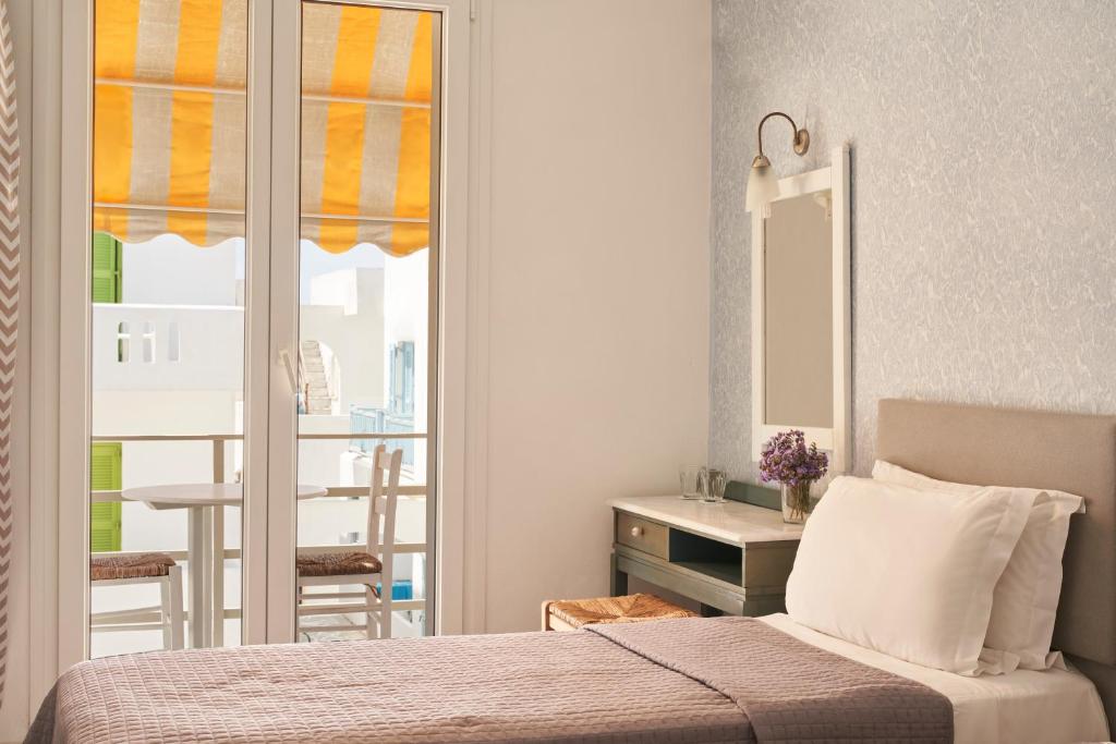 Postel nebo postele na pokoji v ubytování Polos Hotel Paros