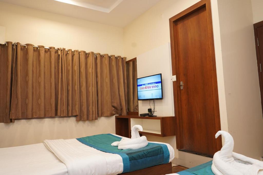 Postel nebo postele na pokoji v ubytování Hotel Satyug