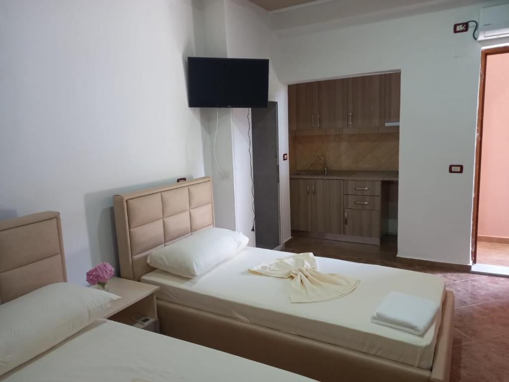 Postel nebo postele na pokoji v ubytování Alexander Stay Hotel