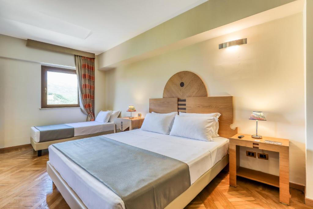 Postel nebo postele na pokoji v ubytování Hotel PentHouse