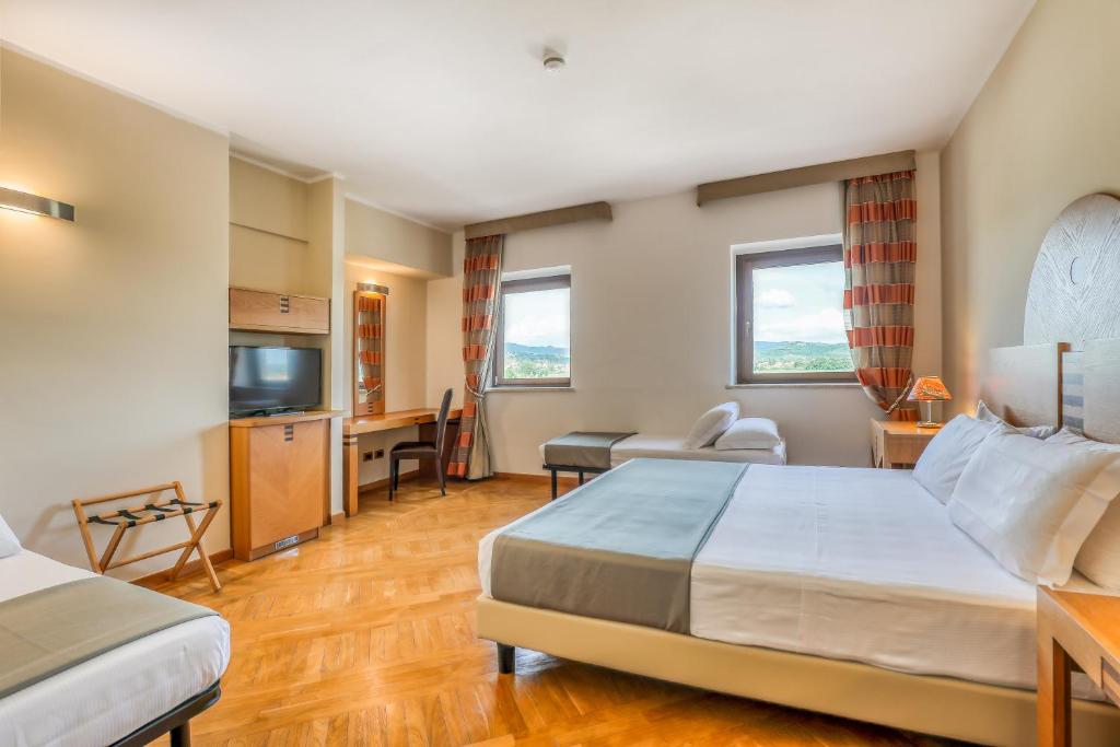 Postel nebo postele na pokoji v ubytování Hotel PentHouse