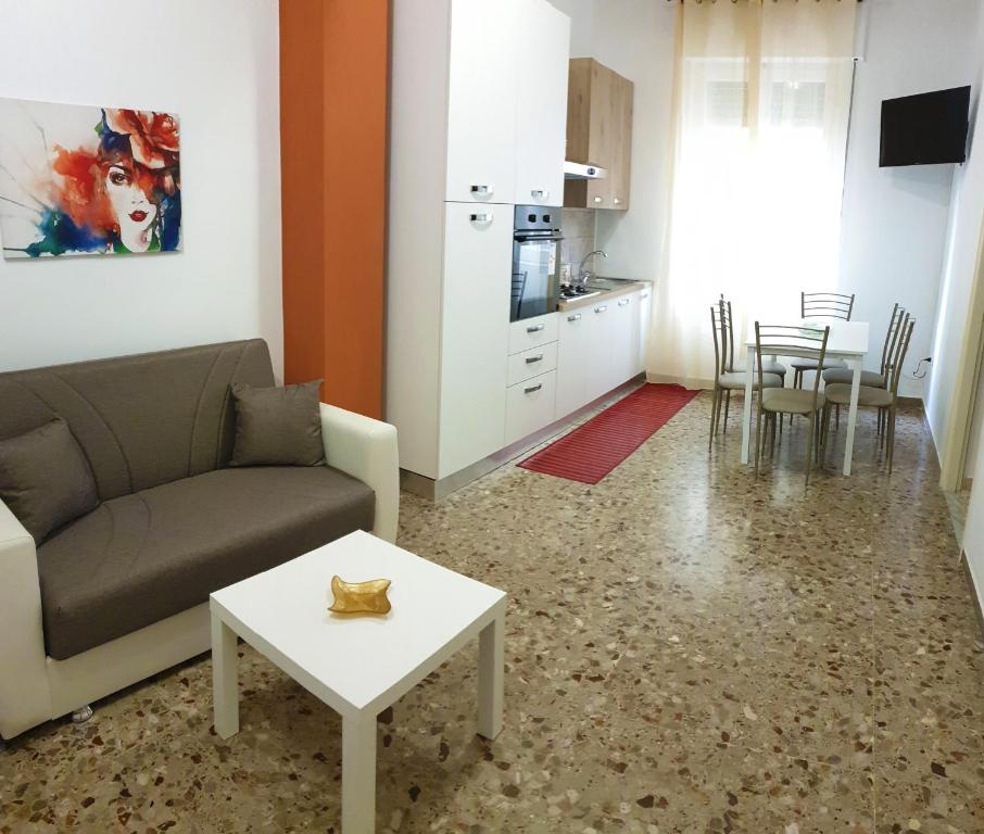 a living room with a couch and a table at Sweet Holidays al centro di Formia in Formia