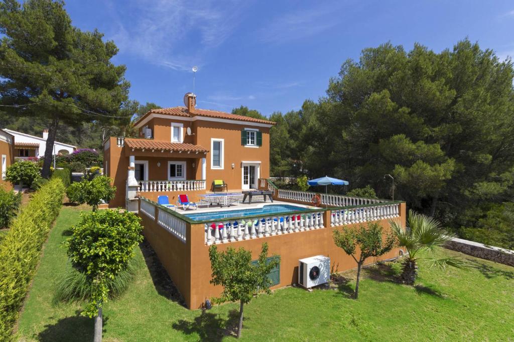 an external view of a house with a swimming pool at Villa Manuel by Villa Plus in Son Parc