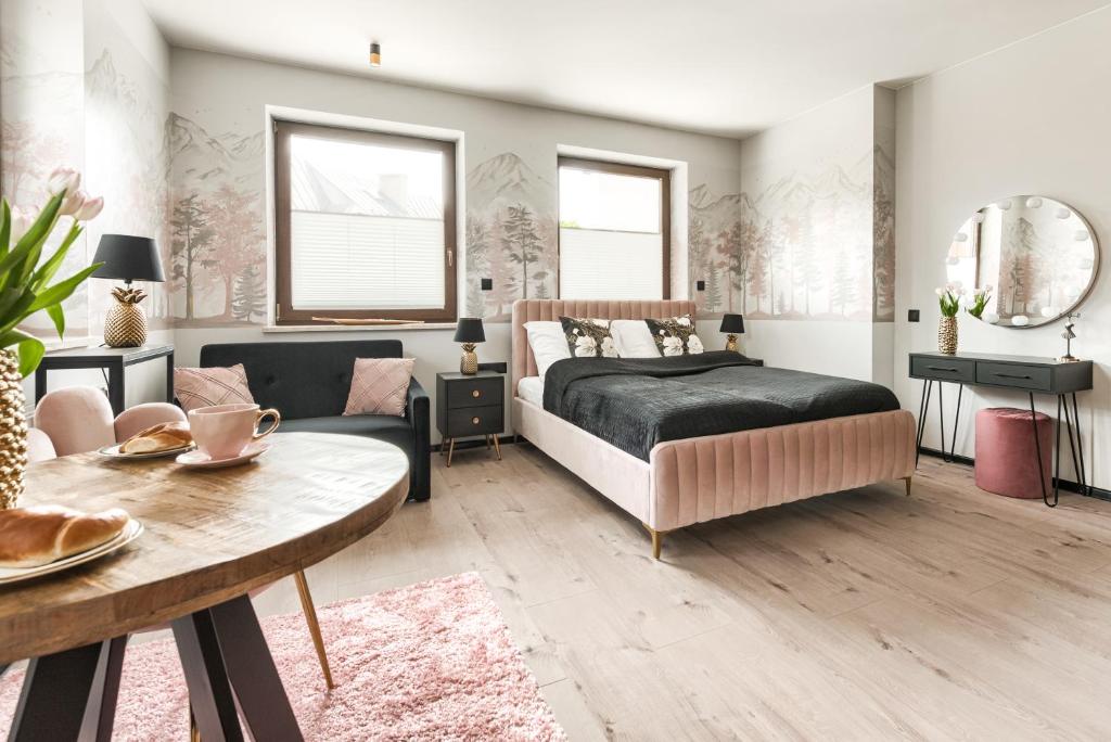 Posteľ alebo postele v izbe v ubytovaní Przytulia Apartamenty i Pokoje