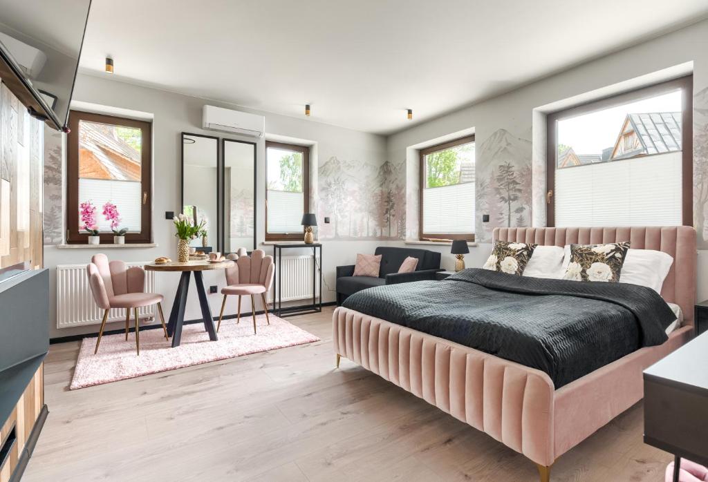 Posteľ alebo postele v izbe v ubytovaní Przytulia Apartamenty i Pokoje